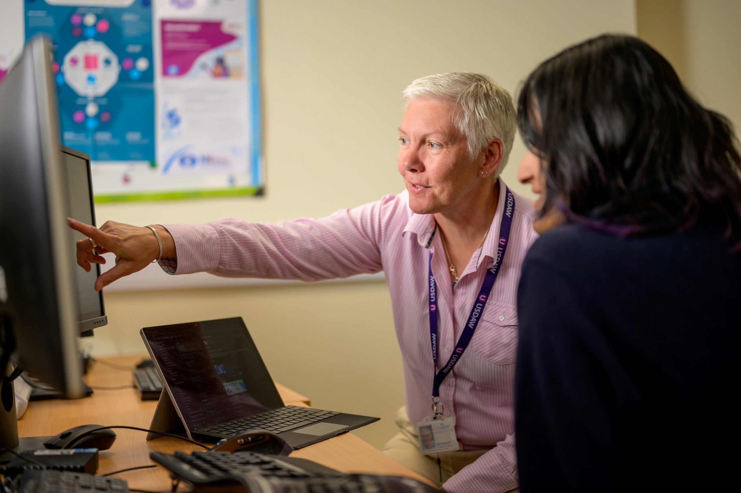 IT manager helping an employee