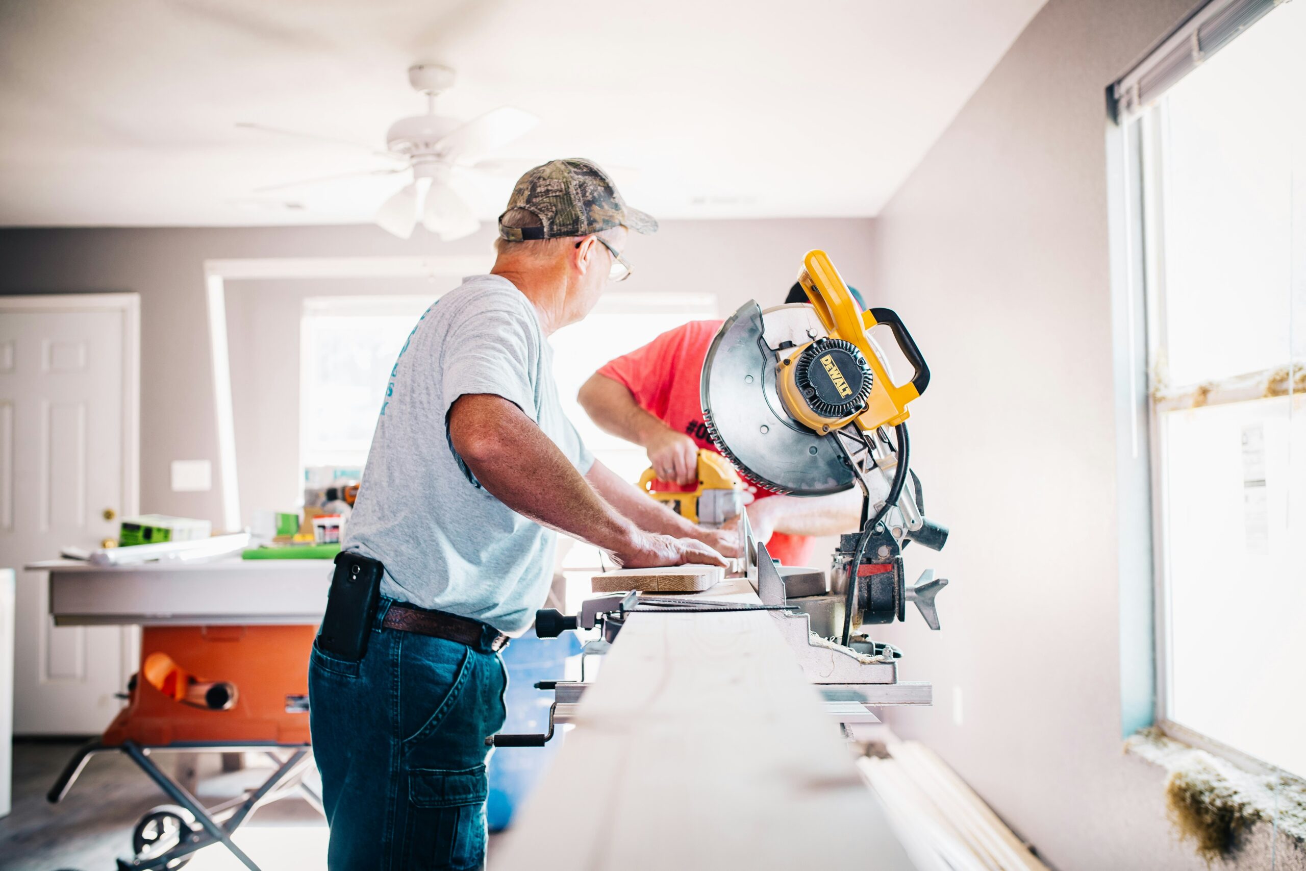 Custom home builder cutting wood