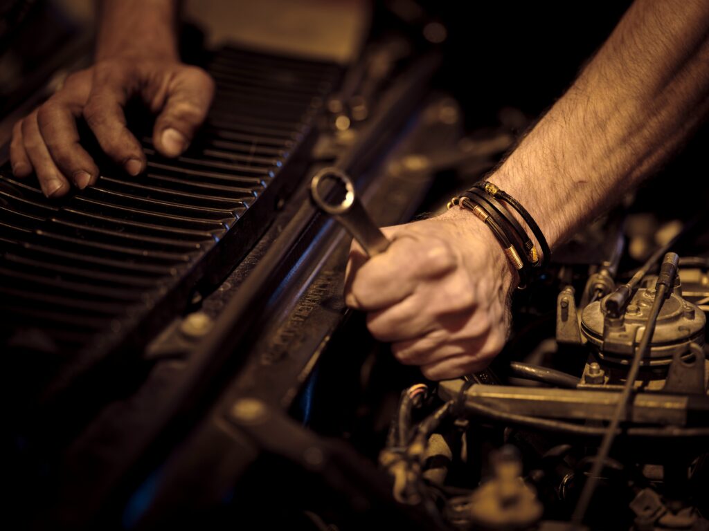 Auto Repair Man Working on a Vehicle