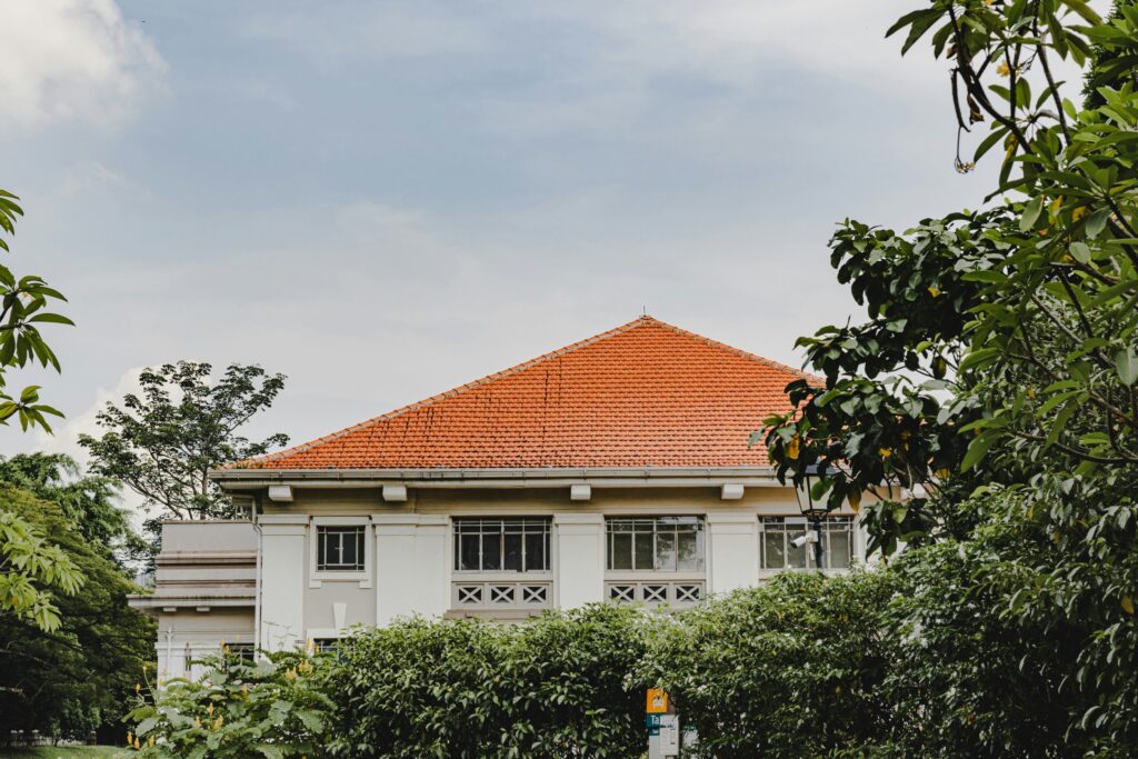 House with orange roof surrounded by trees