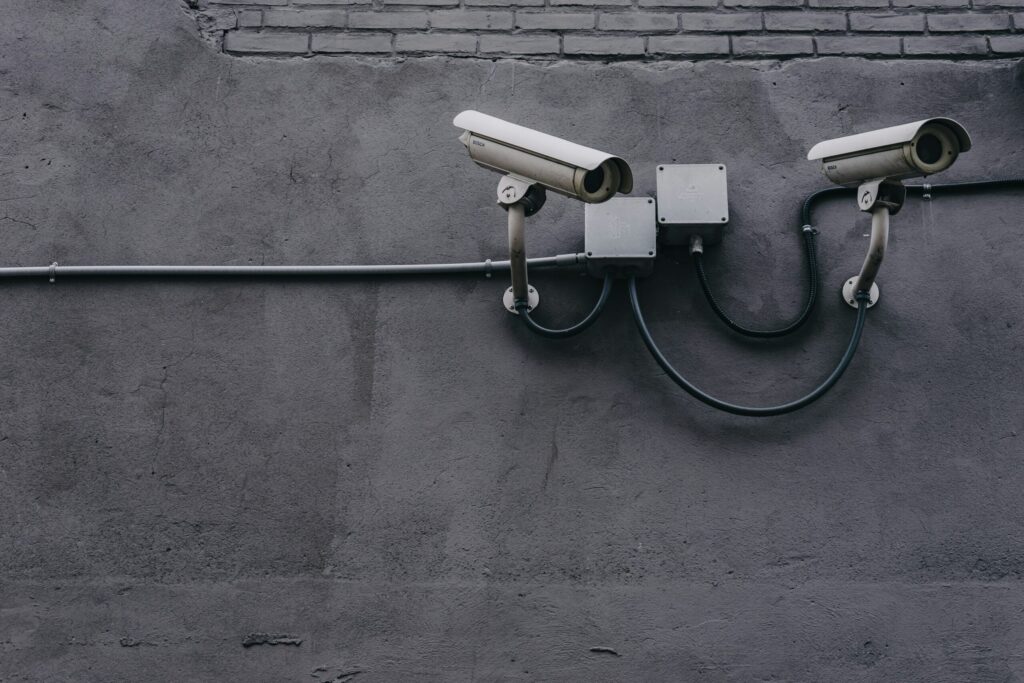 Security cameras on a concrete wall