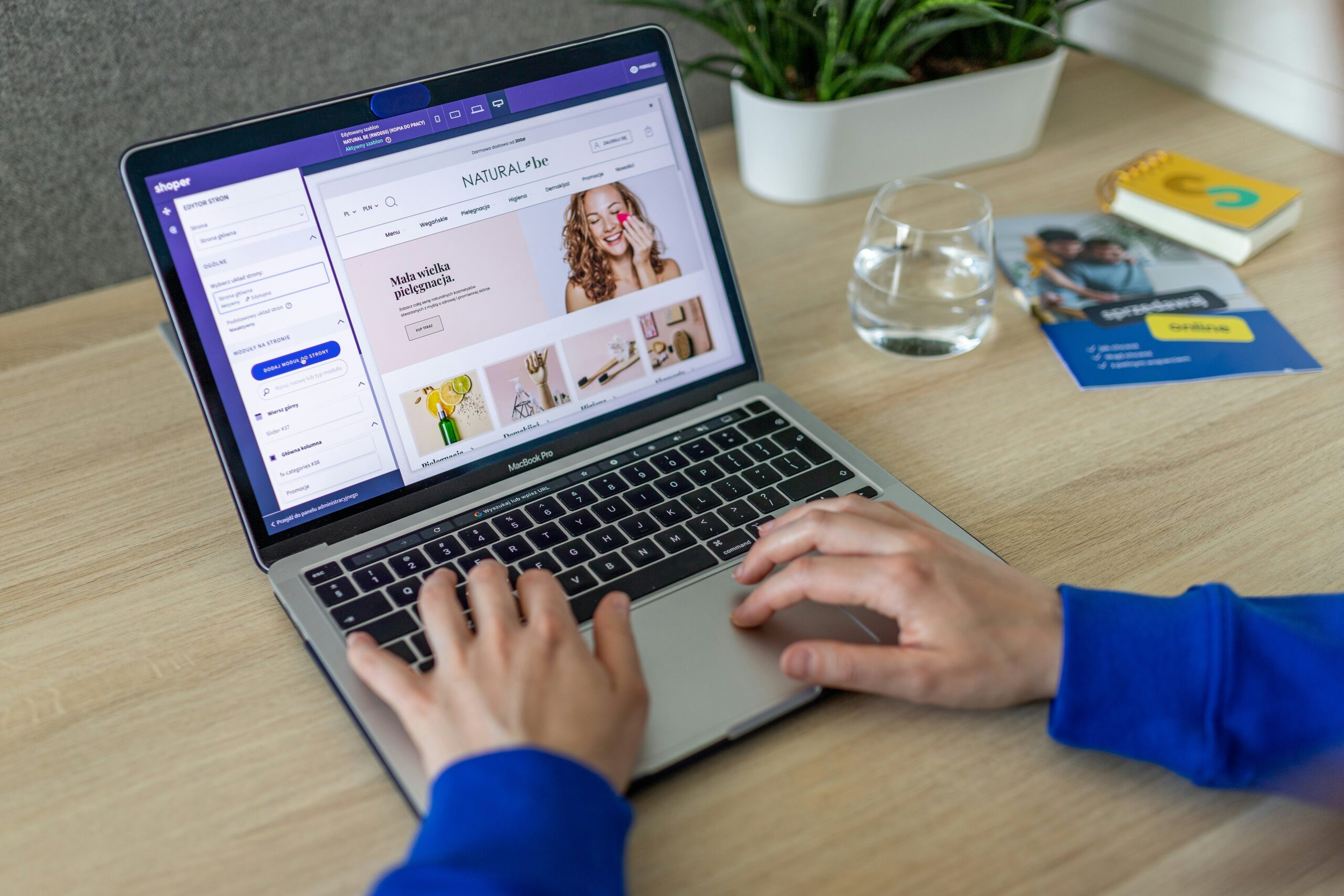 Person working on an E-Commerce Store on a laptop