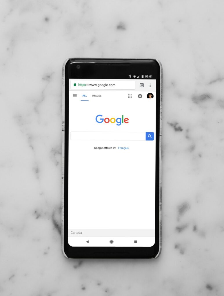 phone resting on a countertop with the google search engine open.