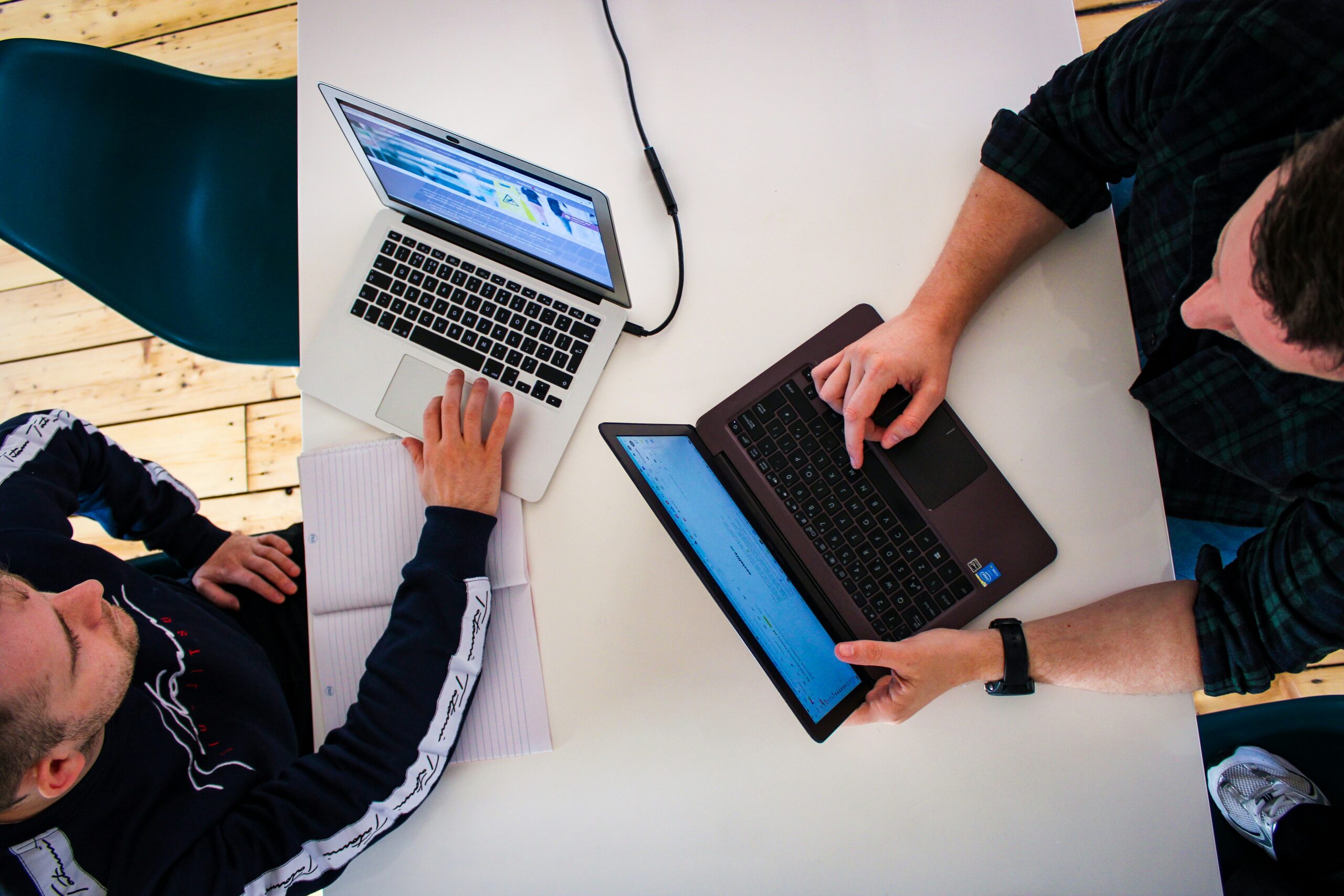 SEO experts typing on laptops