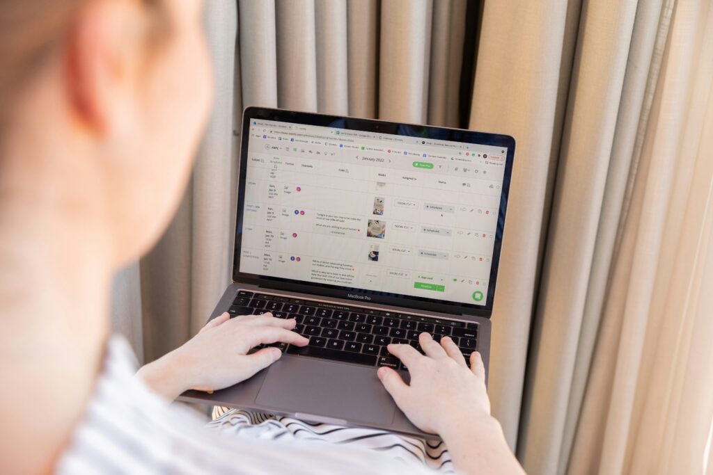 man typing on computer doing seo work