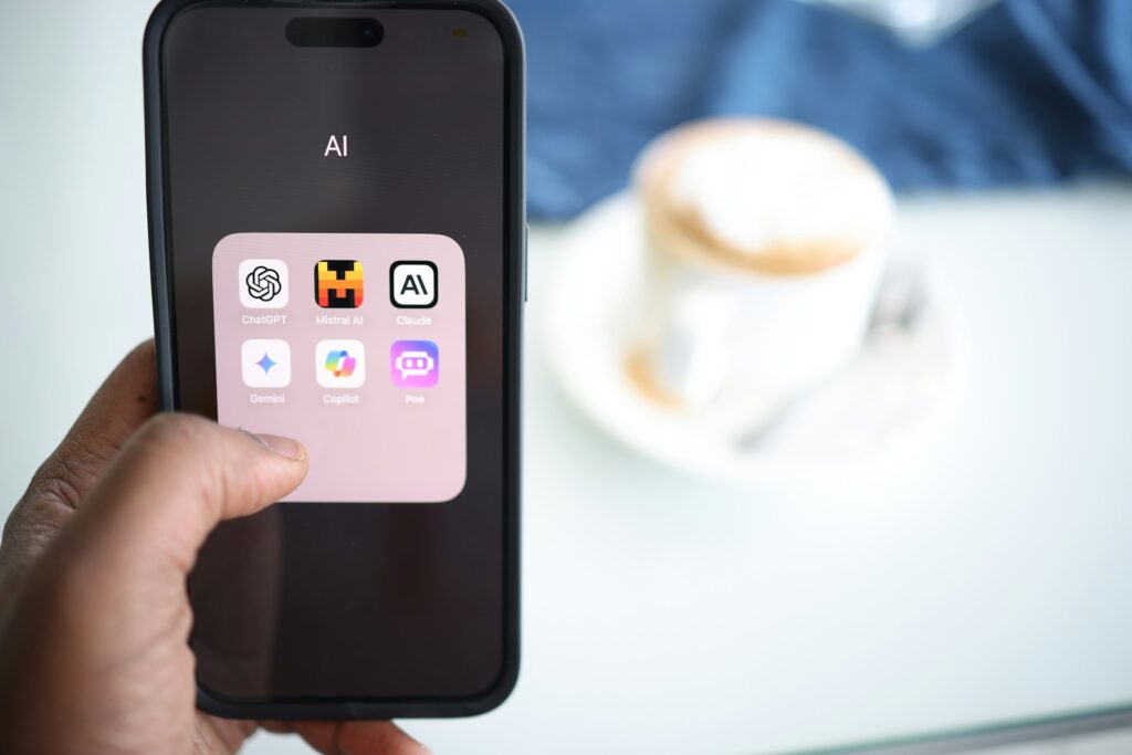 someone holding a phone with ai apps