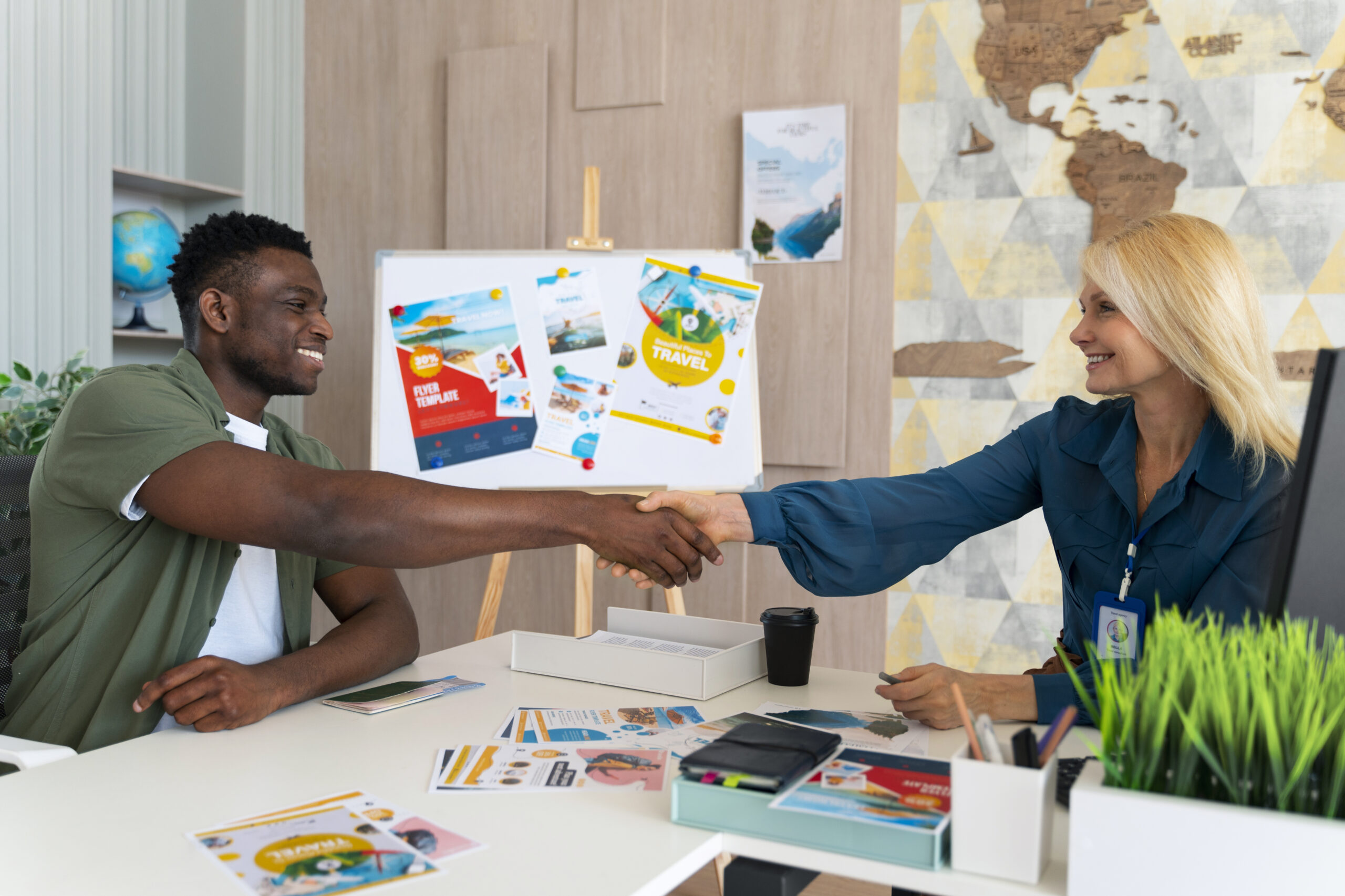 “Business owner shaking hands with a Connecticut advertising and marketing agency professional during a strategy meeting”