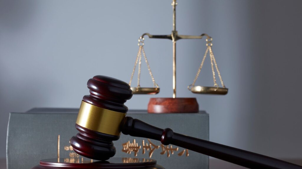 Judge gavel and scales of justice representing law and legal system