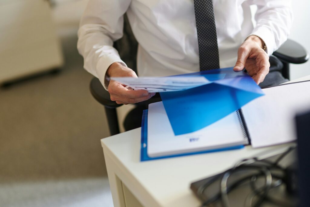 Employee working on paper work at a desk