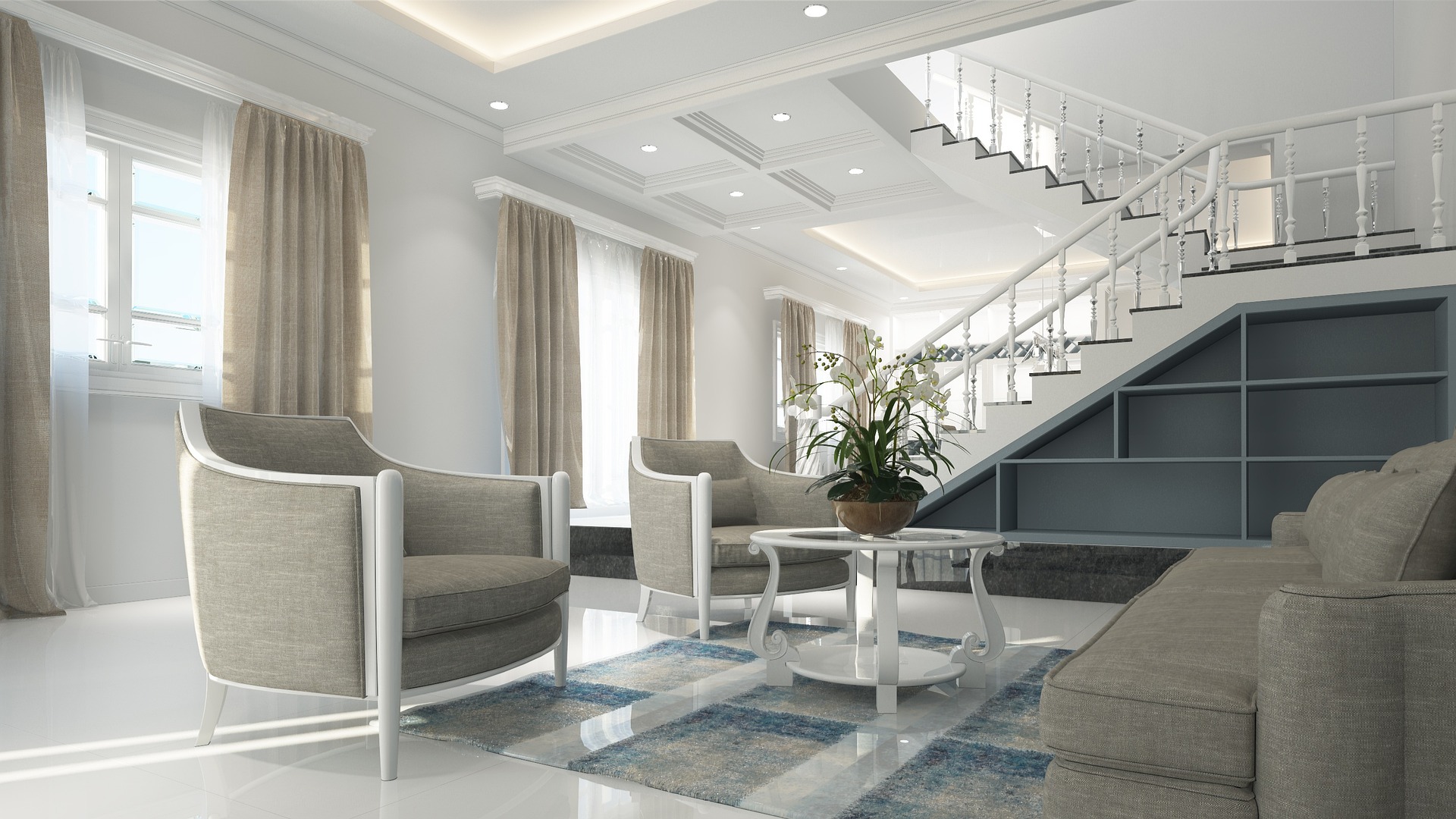 Bright modern living room with gray upholstered furniture, large windows, glossy white floors, and a curved staircase with built-in shelving.