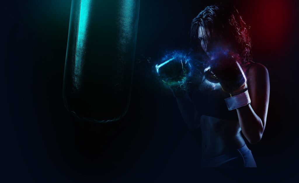 Female boxer in gloves facing a punching bag under dramatic blue and red lighting.