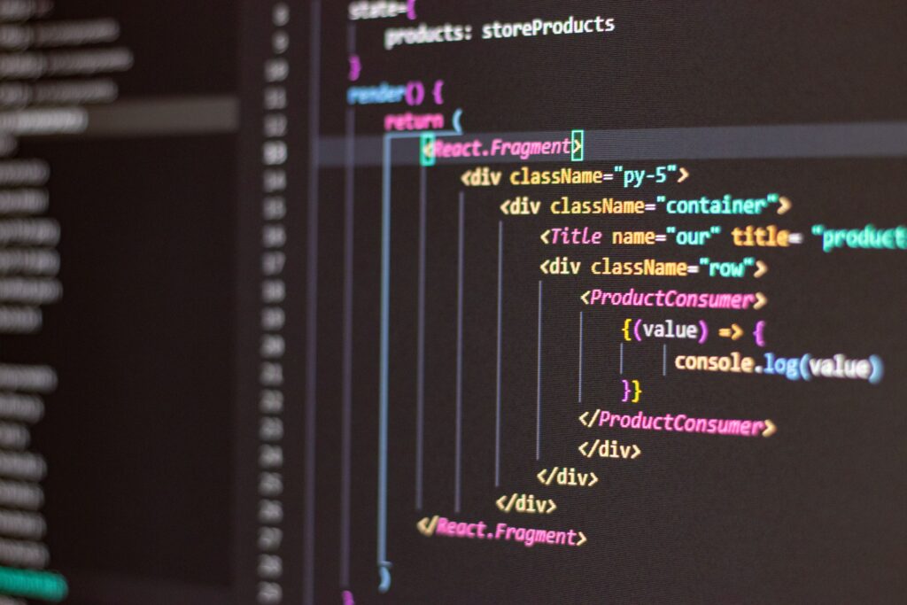 Close-up of colorful React code displayed in a dark-themed code editor.