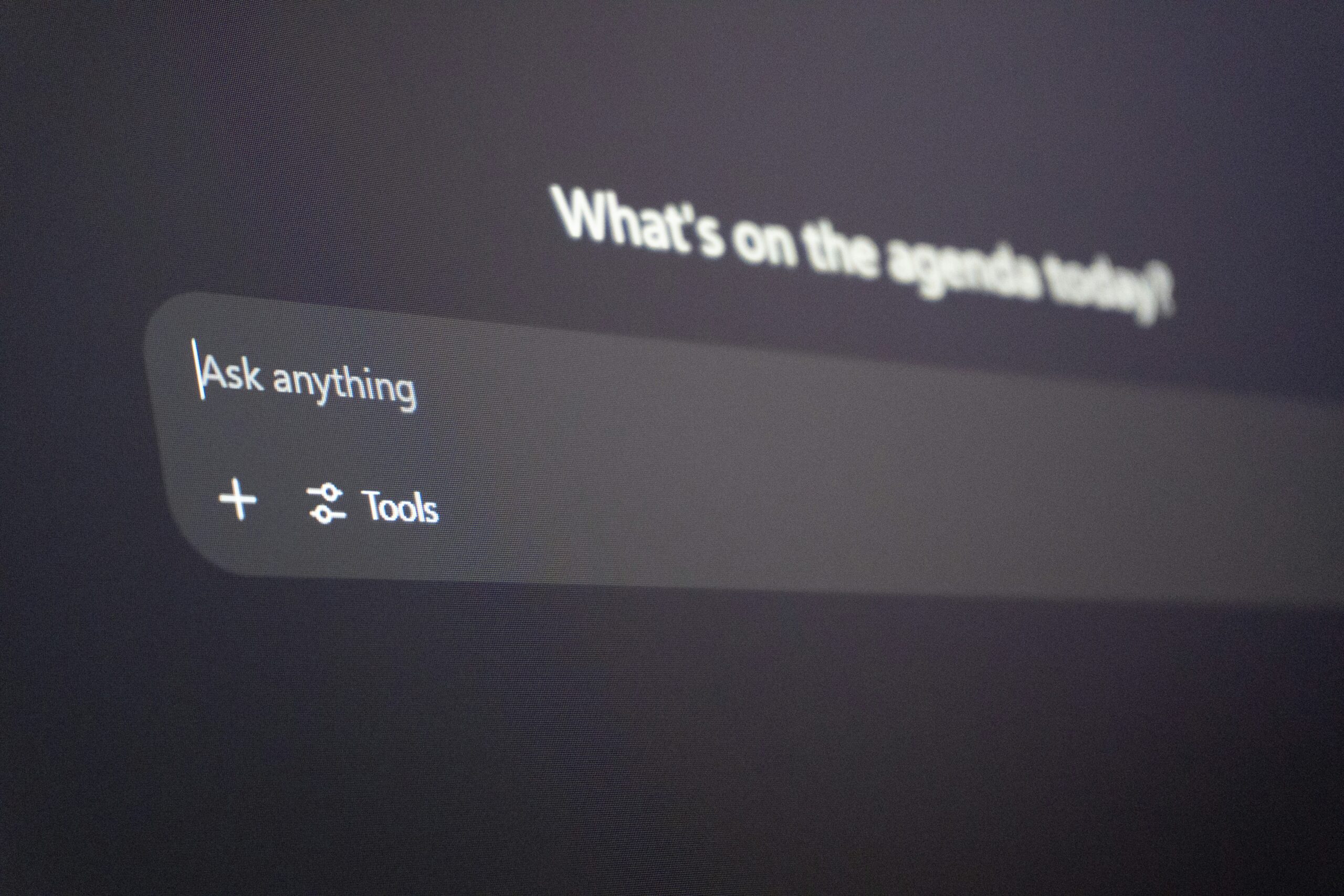 ChatGPT interface in dark mode showing the “Ask anything” prompt box with Tools and add options beneath it.