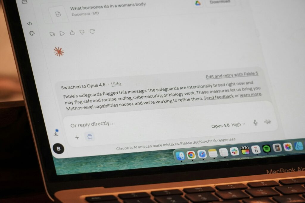 Laptop displaying an AI chatbot interface used to research and compare software